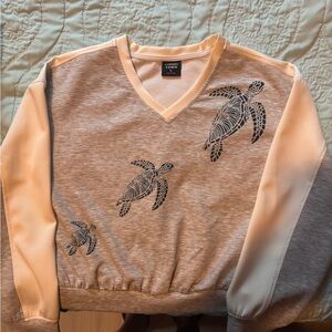 Tinseltown V-Neck Sweater with Turtle Design